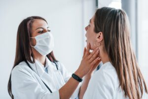 Oral surgeon consulting a patient