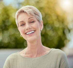 Woman after getting dental implants calgary